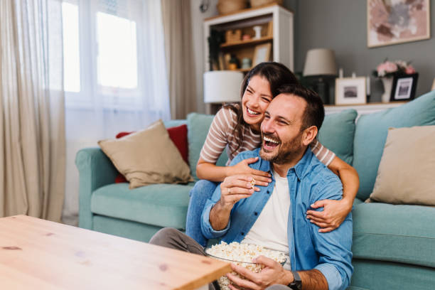 istock Young couple enjoying together at home 2185613507