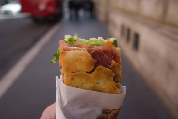 istock POV Handheld Sandwich on the Street 2185616407
