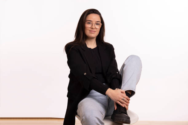 istock Young Spanish woman portrait in front of white backdrop 2185616565