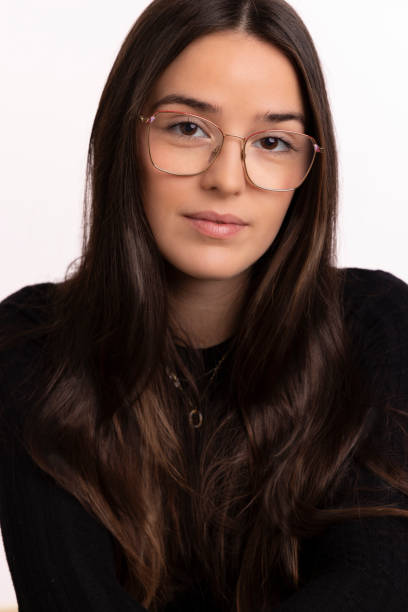 istock Young Spanish woman portrait in front of white backdrop 2185616566