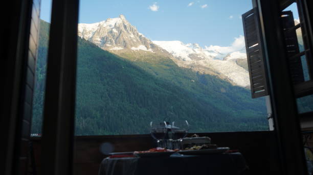 istock Scenic Mont Blanc from Apartment Window with Wine Glasses 2185616851