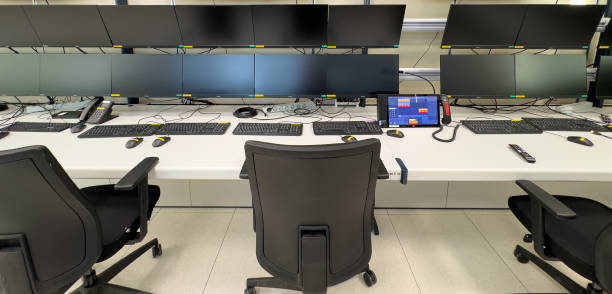 istock A white desk with multiple monitors and keyboards sits empty in a control room 2185617009