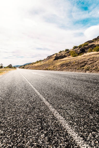 Picturesque landscape scene and sunrise above road