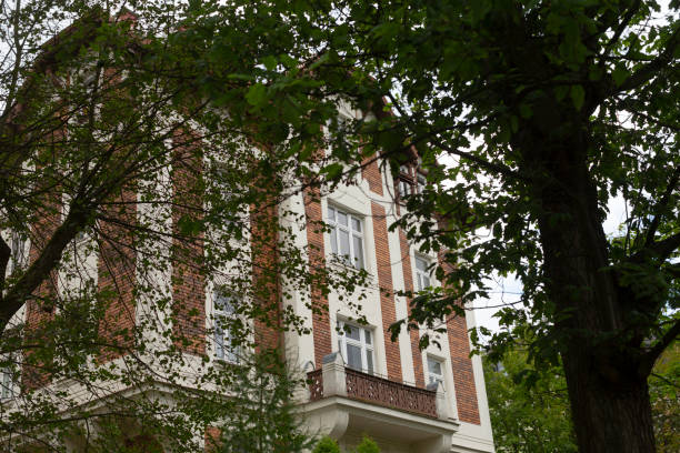 istock An Elegant Brick Building Nestled Among Lush Greenery and Landscaping 2185618065