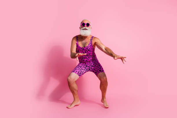 Full length photo of charismatic elderly cool man enjoy disco clubbing wear leopard print overall isolated on pink color background Full length photo of charismatic elderly cool man enjoy disco clubbing wear leopard print overall isolated on pink color background. gay man men sunglasses party stock pictures, royalty-free photos & images