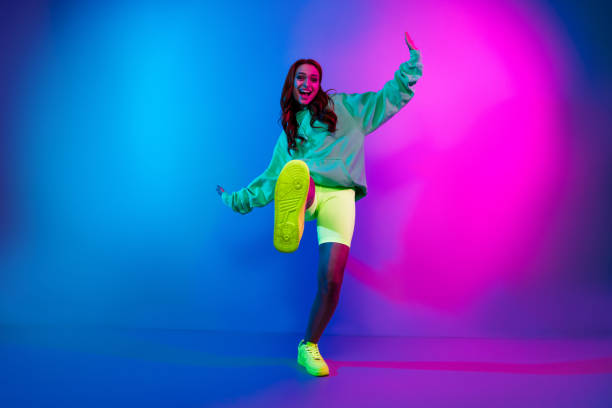 istock Full length photo of cheerful funky lady dressed having disco fun walking empty space isolated neon pink color background 2185620690