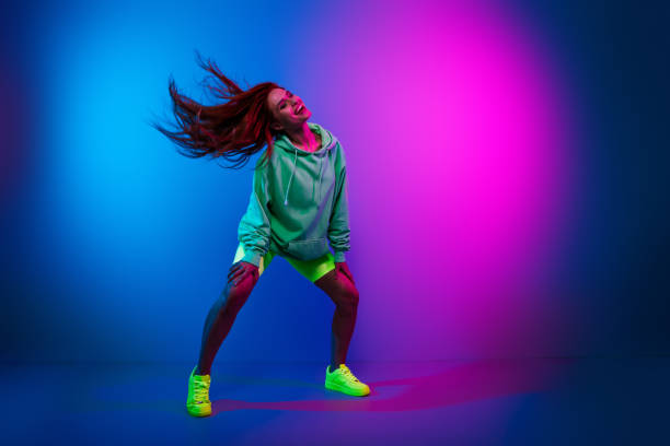 istock Full length photo of cheerful pretty lady dressed sweatshirt having disco fun empty space isolated neon pink color background 2185620734