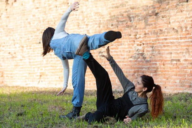 Two young performers dancing outdoors in the city streets in New York.