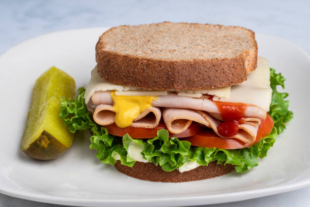 istock turkey  sandwich with  with tomato and lettuce 2185621950