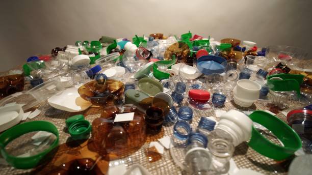 istock Plastic garbage pile from household collected on the table. Single-use or one time use waste discarded. City home trash made of plastic. Empty used bottles and cups create environmental pollution. 2185622223