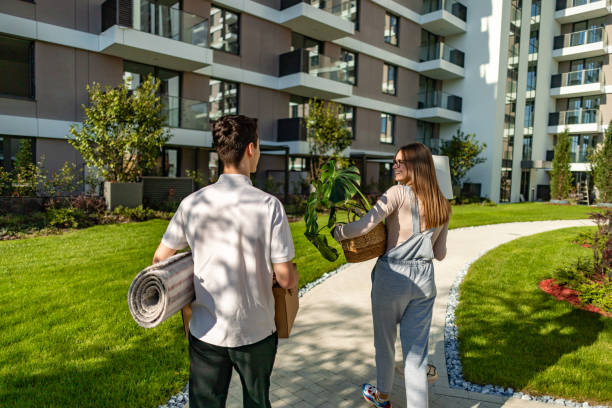 istock Two friends transporting their essentials to a high-rise residence 2185622855
