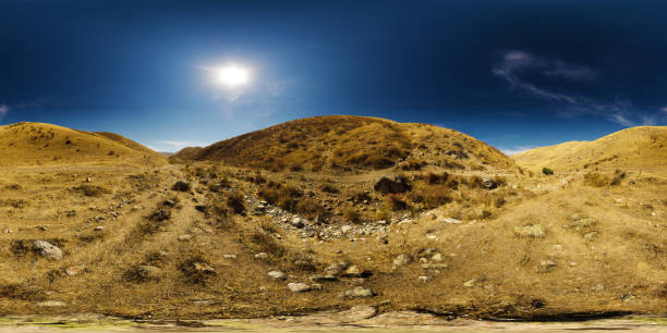 Full Spherical panorama of dry river bed between hills and clear blue sky above at sunny autumn day in equirectangular projection.