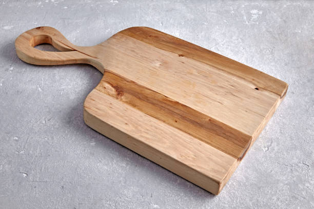 istock figured wooden board for cutting vegetables on a gray stone table 2185624993