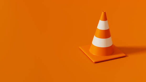 istock Orange Traffic cone isolated on orange background. Safety warning or under construction symbol. 3d render illustration 2185628565