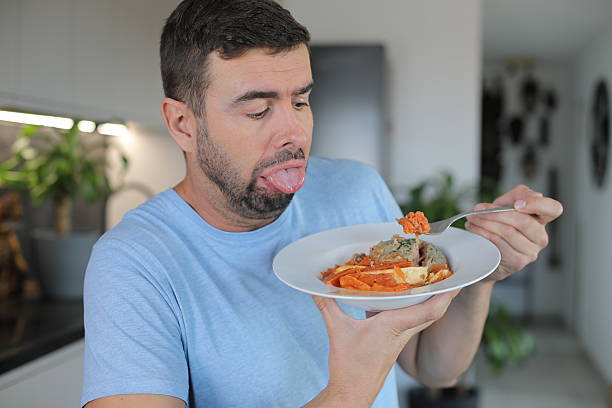 istock Grossed out man disliking his meal 2185630773