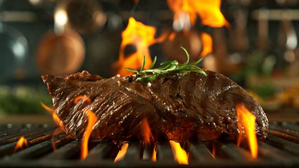 istock Tasty Beef Steak Placed on Grill Grid. 2185631407