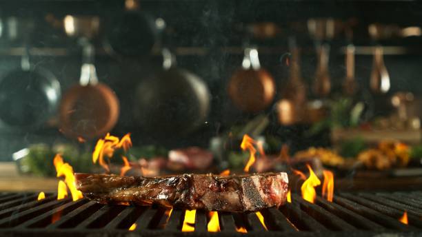 istock Tasty Beef Steak Placed on Grill Grid. 2185631432