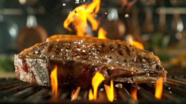 istock Tasty Beef Steak Placed on Grill Grid. 2185631463