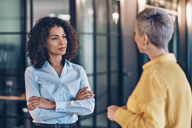 istock Two businesswomen talking 2185634658