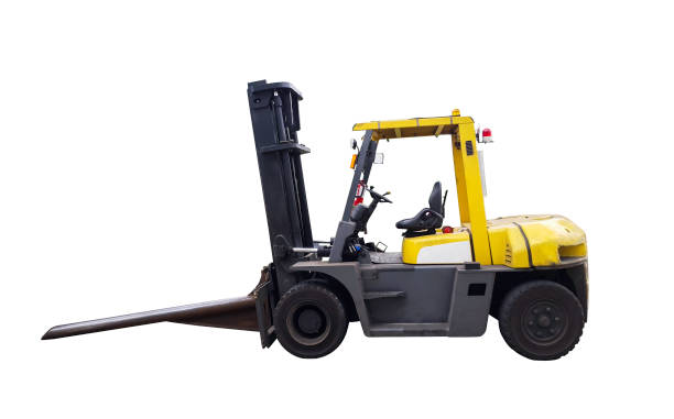 Black female warehouse worker using a forklift to move boxes in a factory warehouse.