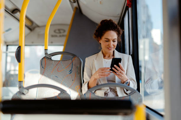 istock Commuter Checking Her Messages on Smartphone During Bus Ride 2185637300
