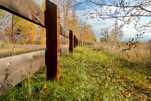 istock Wooden Fence in Grass Field 2185637441