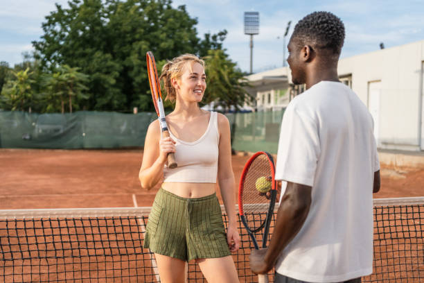 istock Cheerful tennis players chatting before the game 2185639761