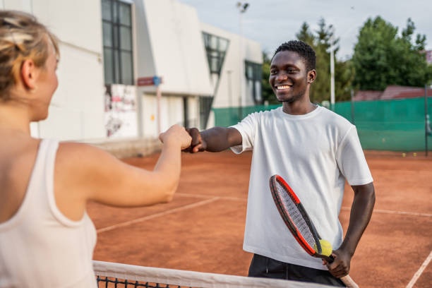 istock Tennis players greeting each other 2185640898