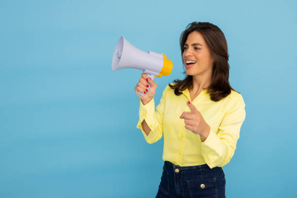 istock Young Latina professional with a megaphone for communication 2185641199