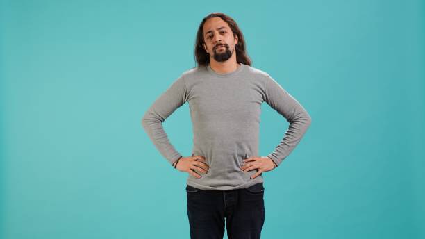 istock Portrait of man standing confidently with hands on hips 2185641512