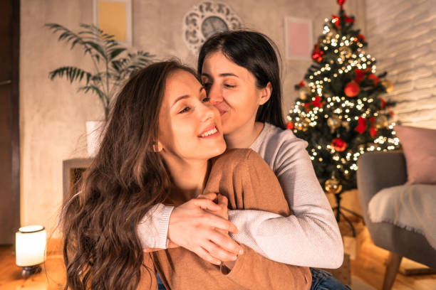 istock Two women enjoying at Christmas. 2185642257