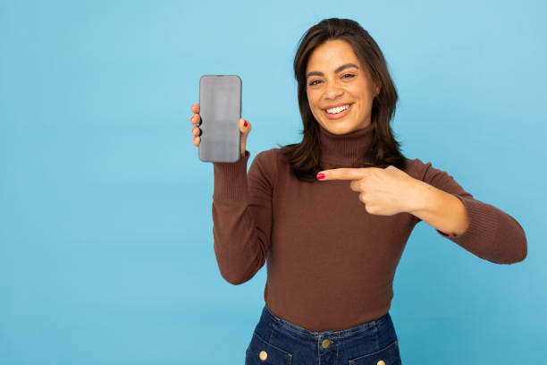 istock Confident Latina entrepreneur using her smartphone 2185642620
