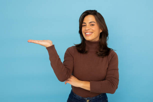 Latina entrepreneur showing something with a hand gesture