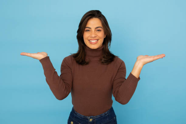 istock Latina entrepreneur showing something with a hand gesture 2185644191