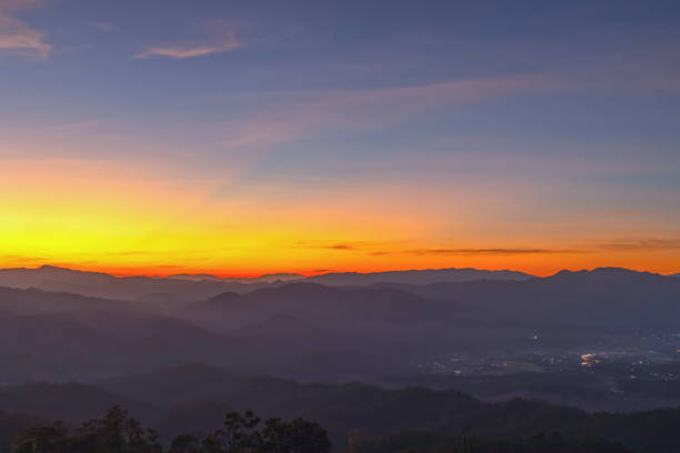 istock Heaven at early morning with copy space. Sunset with mountains, sunrise backdrop.Predawn clear sky with orange horizon and blue atmosphere. Smooth orange blue gradient of dawn sky. 2185645035