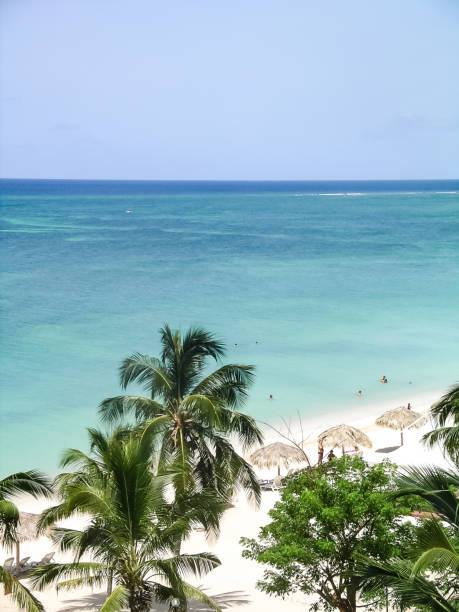 istock Playa Ancon at Trinidad in Cuba features crystal blue and turquoise waters lapping against pure white sand, creating a tropical paradise 2185647004