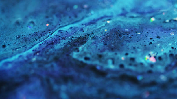 istock Shimmering emulsion sparkling fluid flow blue ink 2185647294