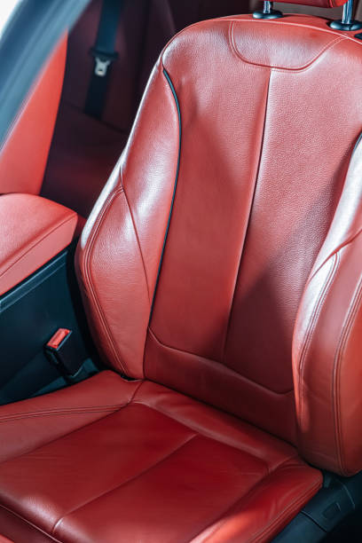 istock Car inside. Interior of prestige modern car. Comfortable red leather seats. Leather cockpit, Modern car interior details. 2185647453