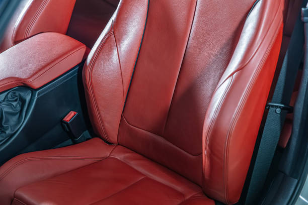 istock Car inside. Interior of prestige modern car. Comfortable red leather seats. Leather cockpit, Modern car interior details. 2185647475