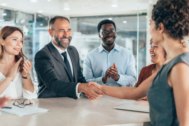 istock Shaking hands with new colleague 2185650114