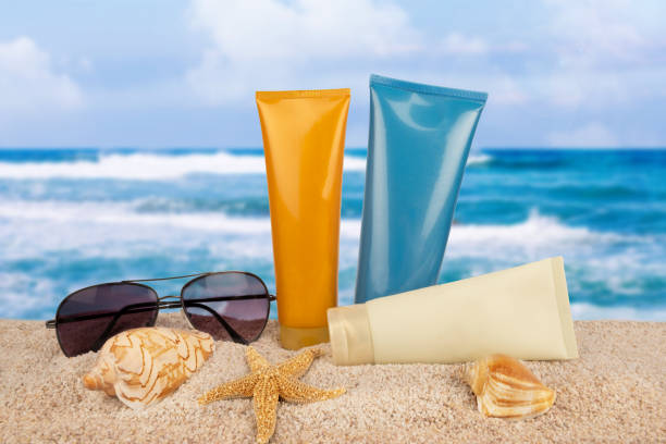 istock A beach scene with three tubes of sunscreen. 2185657526