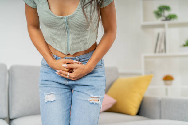 istock Woman touching her belly complaining about menstruation 2185660009