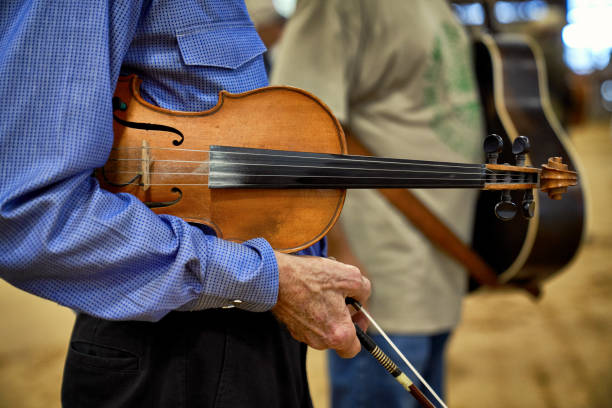 istock Man holding his Fiddle and bow 2185662636