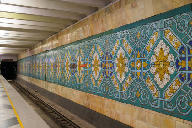 A long train station with a wall of tiles on it in Tashkent, Uzbekistan