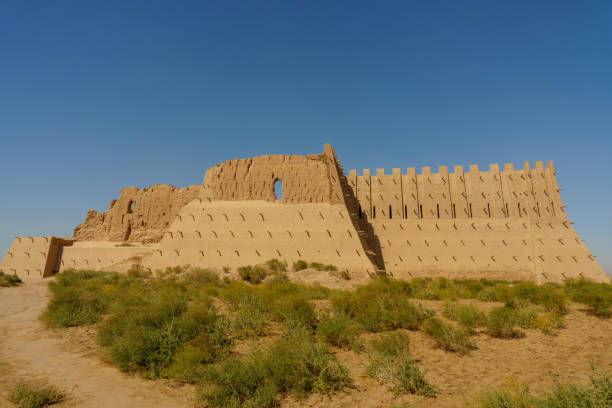 istock A large, crumbling building sits in a field of grass 2185663823