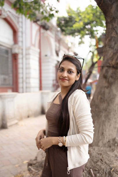 istock Young woman smiling outdoors 2185664007