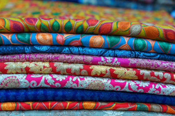 istock A stack of colorful fabrics with a variety of patterns and colors 2185664010