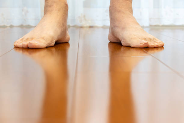 istock Stand barefoot on a wooden floor 2185665751