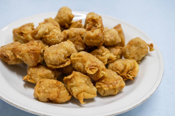istock Close-up view of the deep fried pork dumpling on the plate. It also knowns as wontons 2185670202