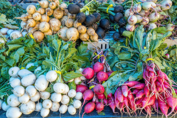 Radish in various shapes and colors for sale at a market